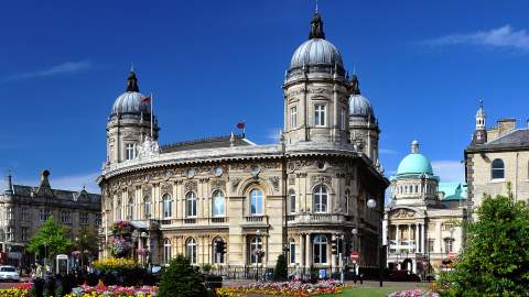 Hull Maritime Museum exterior with ornate historic architecture and colourful flower displays on a sunny day