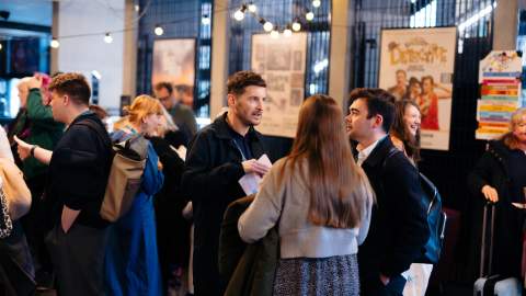 Delegates networking at Cultural Tides 2025 in the ground floor  lobby of Hull Truck Theatre