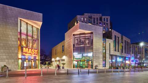 The cultural quarter at night showing John Hansard Gallery and Mayflower Studios buildings with signage lit up