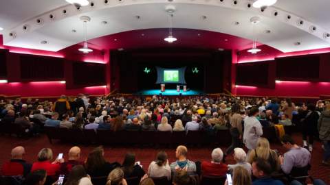 A conference takes place inside the Floral Pavilion