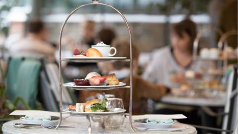 Afternoon tea stand with cakes and scones