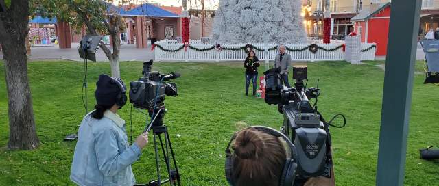 Video production crew in front of Chandler Tumbleweed Tree