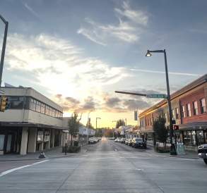 Storefronts and pedestrians along a shopping street in downtown Renton