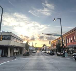 Storefronts and pedestrians along a shopping street in downtown Renton