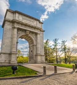The iconic arch at Valley Forge National Historical Park in King of Prussia on a sunny day.