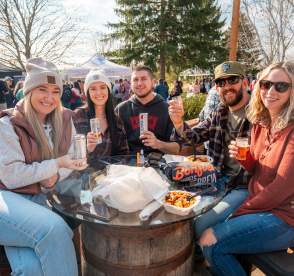 Festival goers smiling at Bonfires, Barrels & Brews