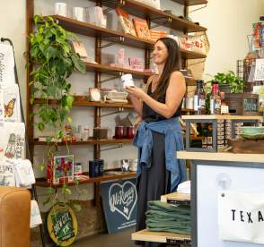 Woman looking at shelves shopping in a store