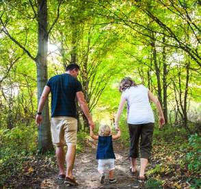 Family walking in the woods