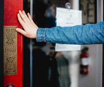 A woman opening a door