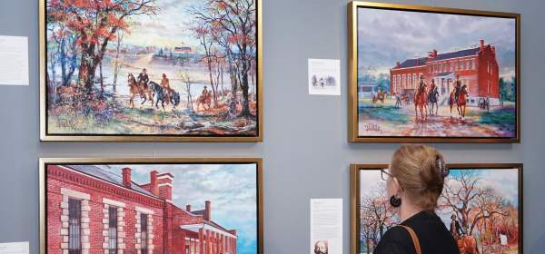 Women viewing John Bell paintings