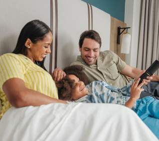 Family in a hotel bed
