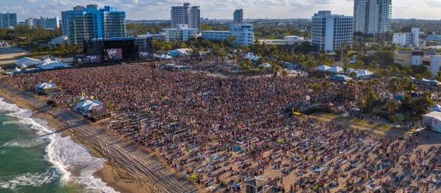 Aerial view of crowd at Tortuga Music Festival on Fort Lauderdale Beach taken looking southwest from the Atlantic Ocean