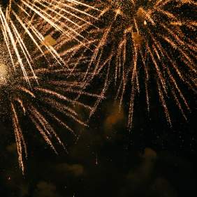 gold fireworks on dark sky