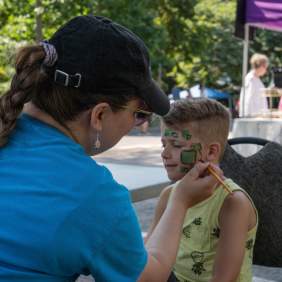 Child having face painted