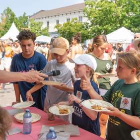Children eating peach pie