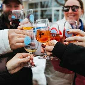 Group of friends holding Icewine glasses