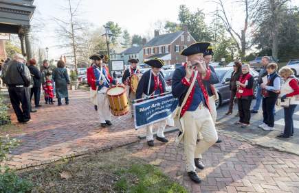 Colonial fife and drum corps in historical uniforms at Odessa holiday event