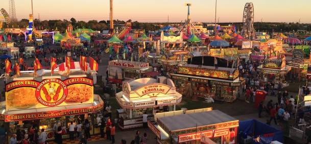 Fair booths and people at the South Texas State Fair