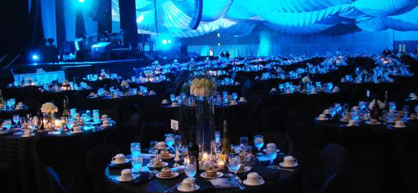 Ballroom set up with tables, candles and wine at the Beaumont Civic Center