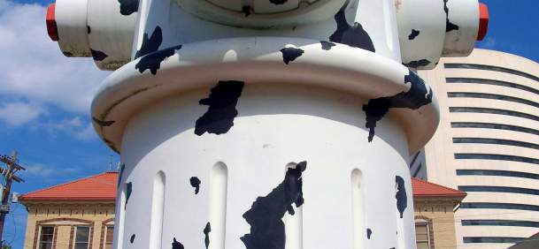 Girl sitting in front of the Giant Fire Hydrant in Beaumont