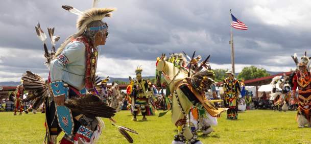 Dancers in colorful regalia performing at the Eastern Shoshone Powwow in Wyoming.
