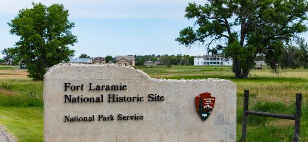 Historic structures at Fort Laramie National Historic Site surrounded by open grasslands in Goshen County, Wyoming.