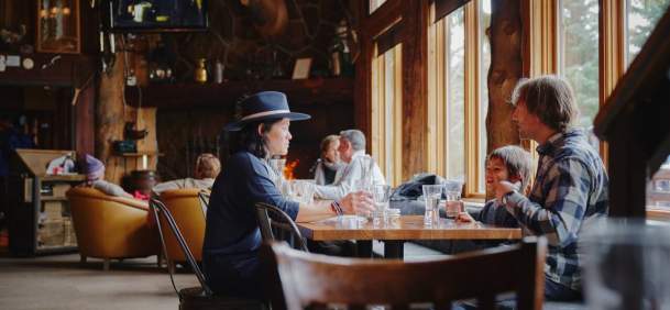 Bustling Teton Village restaurant with visitors in Teton County, Wyoming.