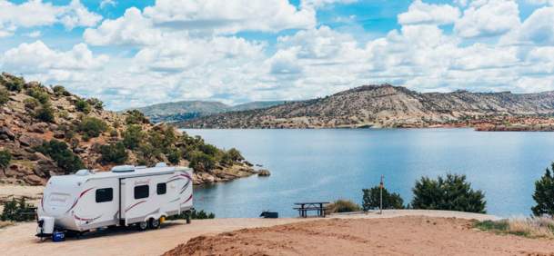 Serene waters of Alcova Reservoir surrounded by rocky cliffs in Natrona County, Wyoming.