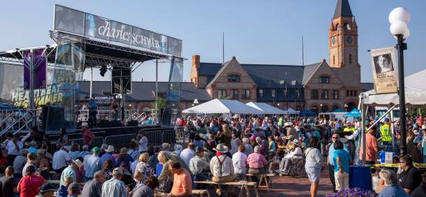 A lively, high-energy photo of one of the most famous community traditions in Wyoming. The Cheyenne Frontier Days Free Pancake Breakfast is a massive logistical feat held three times during "The Daddy of 'em All" in downtown Cheyenne.