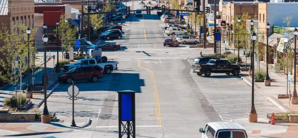 Lively downtown street in Gillette, Wyoming, lined with shops and historic buildings.