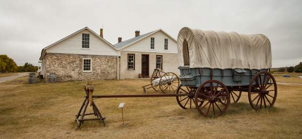 Historic Fort Laramie with wagon and open grasslands in Goshen County, Wyoming.