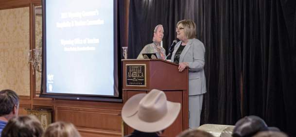Wyoming Office of Tourism hosting a presentation to a crowd