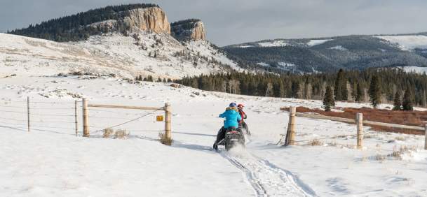 Snowmobile navigating a snowy trail in the Bighorn Mountains, Sheridan County, Wyoming.