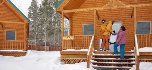 people on cabin porch