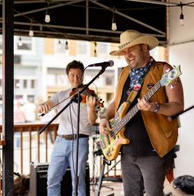Live band performing outside CJ’s Coffee Café in Downtown Denison