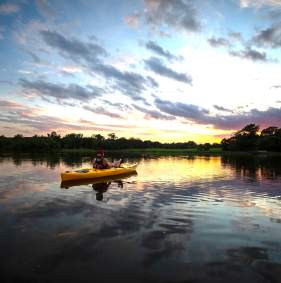 Visitors kayaking on Waterloo Lake in Denison, Texas