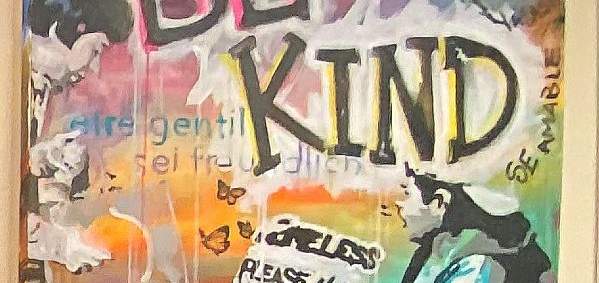 a colorful painting with a man sitting holding a homeless sign and large black letters that say "be kind"
