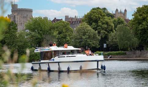 Le Boat cruising on the Thames in front of Windsor Castle