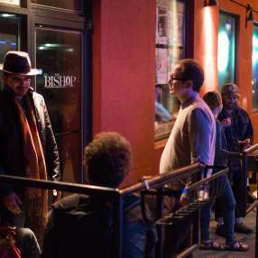 People standing & talking outside of The Bishop Bar