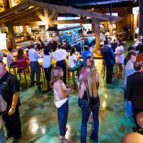 People socializing at the Backyard Music Hall