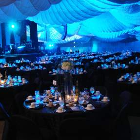 Ballroom set up with tables, candles and wine at the Beaumont Civic Center