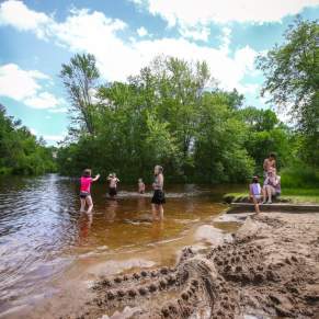 Family playing in the water at Iverson Park