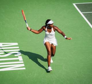 Image of a women with her arm extended about to hit a tennis ball at the ATX Open.