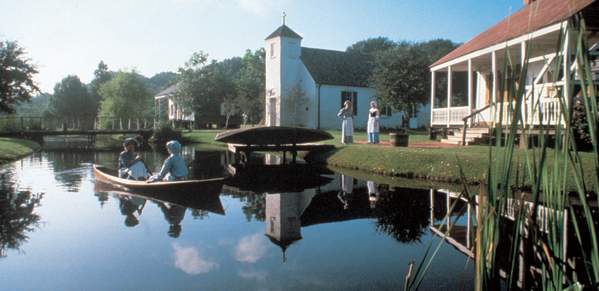 People In A Boat At LARC's Acadian Village In Lafayette, LA