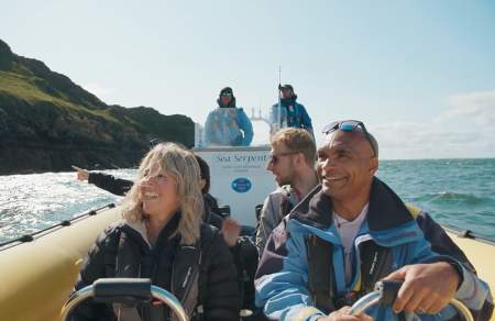 A boat full of people sightseeing