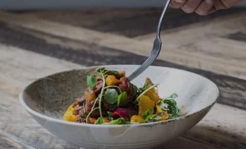 A white plate with healthy food.