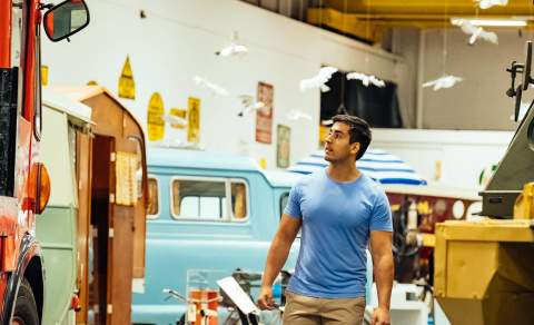 A man walking through Coventry Transport Museum
