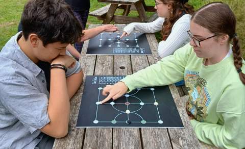 children play a roman game