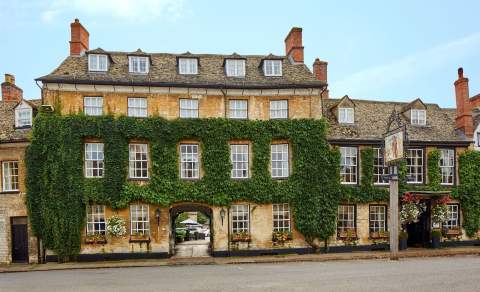 The honey-coloured facade of The Bear Hotel in Woodstock