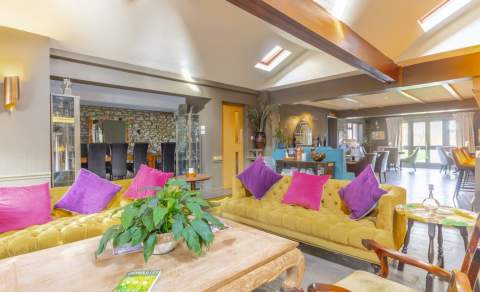 The bright lounge bar area at Pettifers Hotel